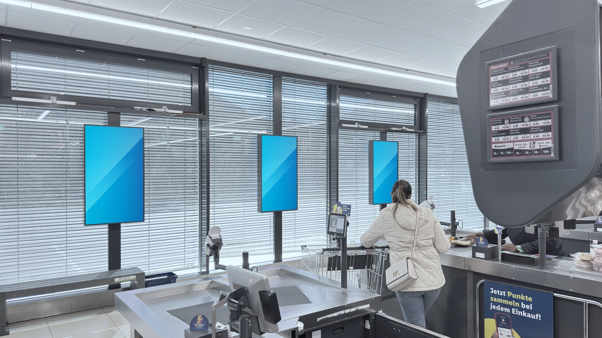 DOOH advertising screens in the till area of a Lidl store in Switzerland